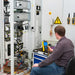 Man calibrating the power with Power-Analysator 