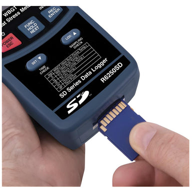 Hand holding a data logger with SD card slot against a white background