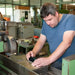 Man using Roughness-Tester in workplace setting